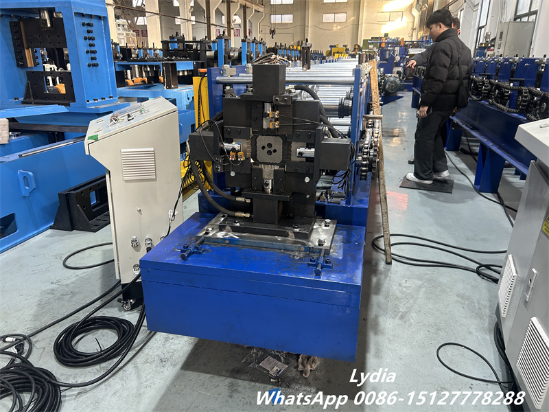 downspout roll forming machine with exit shear cutting system