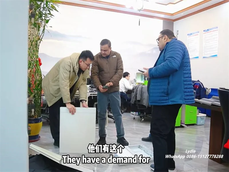 Good News-Zhongtuo Receives Strong Positive Feedback from U.S. Customers on Garage Door Roll Forming Machine 3 U.S. clients inspecting garage door roll forming machine at Zhongtuo